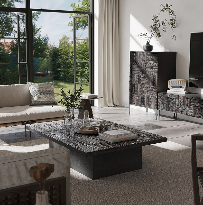 High-end luxury living room set featuring hand-carved solid teak wood coffee table and matching vintage black TV media console with intricate African Tabua geometric relief patterns.