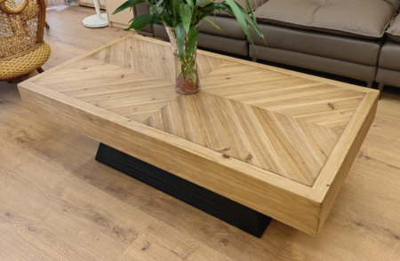 Solid wood coffee table featuring a herringbone-patterned top, rectangular shapes, with a natural wood finish and polished edges, perfect for adding rustic elegance to any living space.
