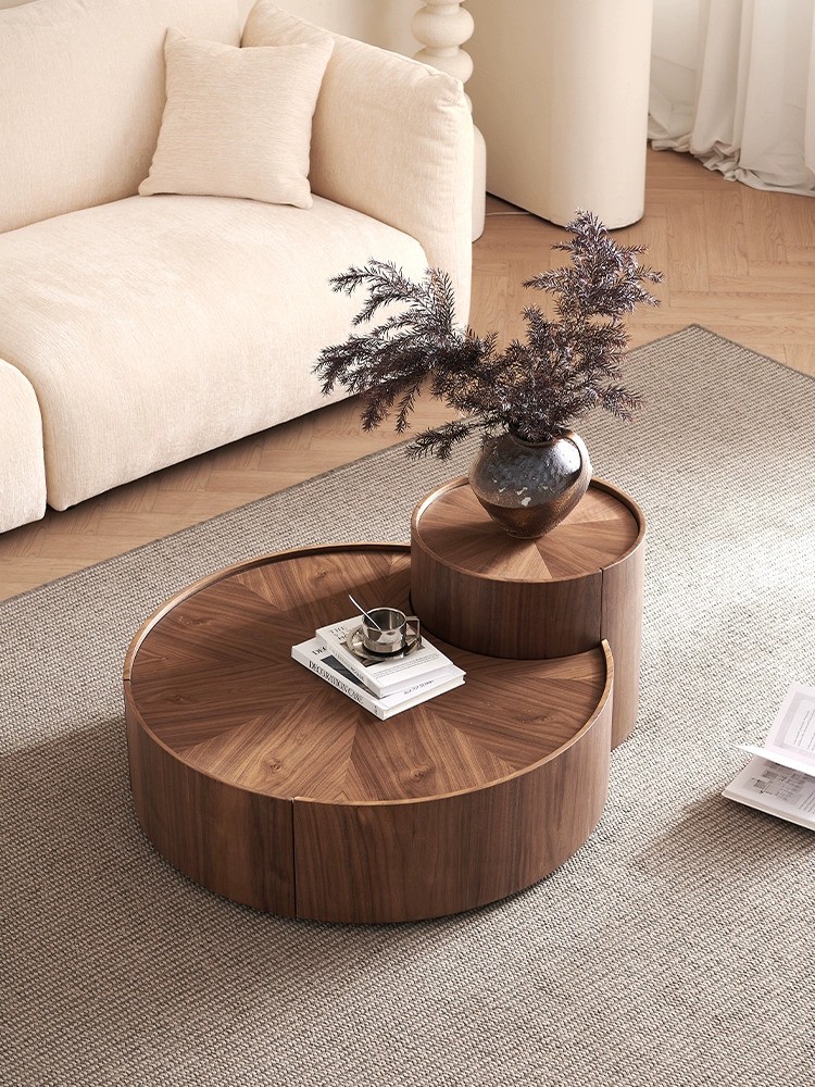 Elegant round two-piece coffee table set in Walnut and Black finish, featuring a low-profile design, drawer, and rotating hidden storage for modern living spaces.