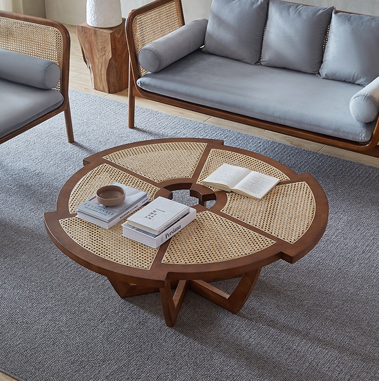 Elegant walnut round coffee table with solid wood base and intricately woven rattan accents, featuring a unique sculptural design and smooth polished finish, ideal for modern and contemporary living spaces
