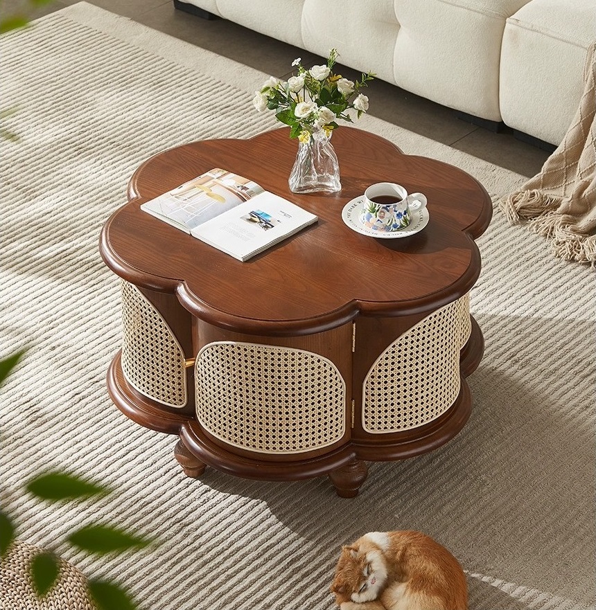 Designer solid wood and rattan round coffee table with floral-shaped top, pedestal base, and hidden storage, available in walnut, black, and cherry finishes.