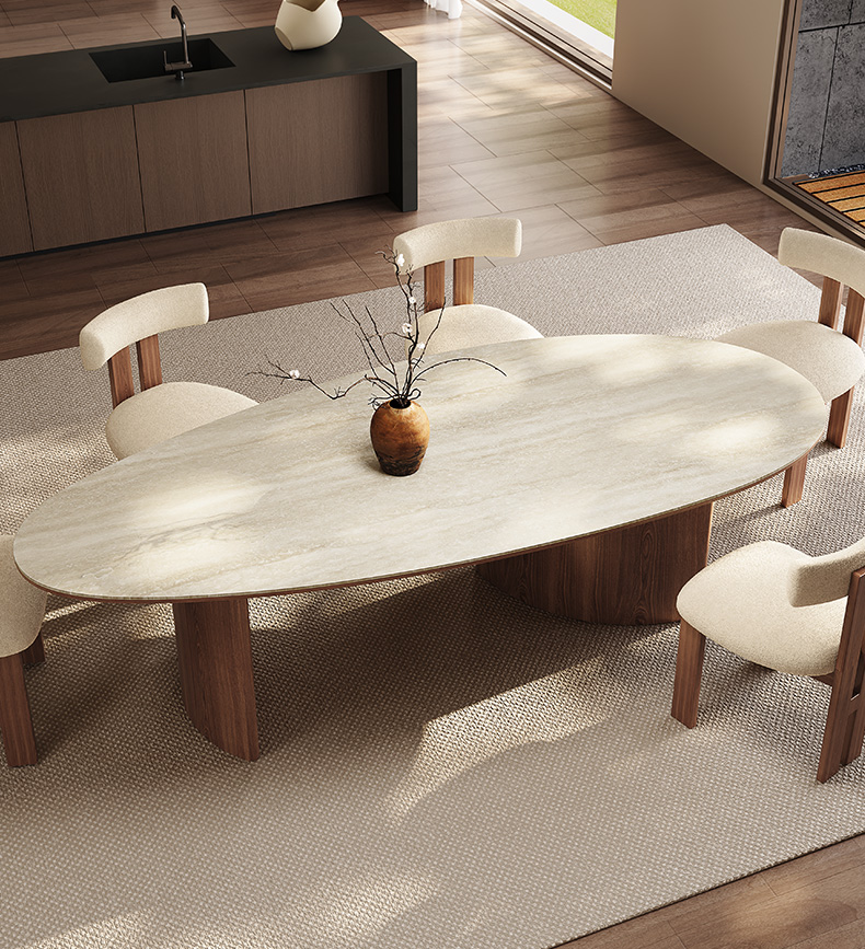 Elegant oval dining table with a beige Italian travertine stone top and dark brown solid ash wood legs, showcasing a modern design.
