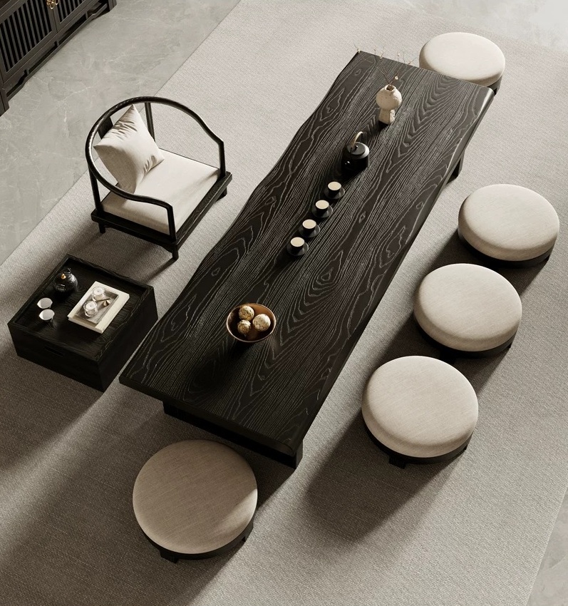 Traditional Japanese tatami low floor tea table with solid wood black ash grain finish, Japandi chabudai dining set with round stools and armchair seating in minimalist zen interior.
