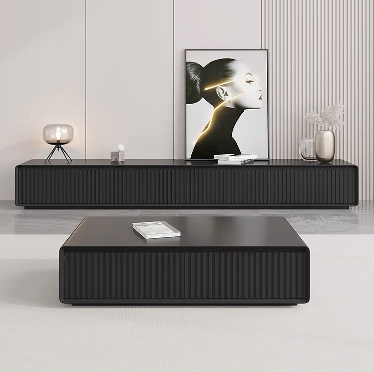 Front-facing view of the contemporary black fluted lowline entertainment unit paired with a matching low-profile black fluted 4-drawer coffee table in a minimalist living room setup.