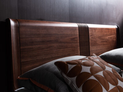 Close up detail of vertical fluted center accent and natural grain pattern on solid FAS grade black walnut headboard