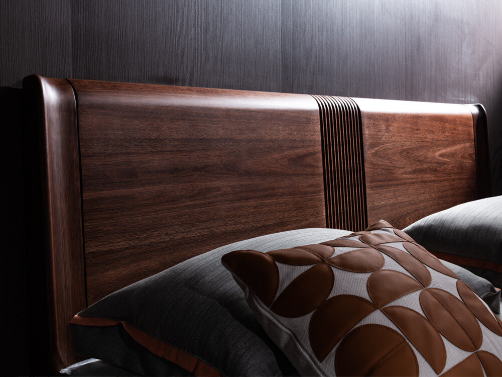 Close up detail of vertical fluted center accent and natural grain pattern on solid FAS grade black walnut headboard