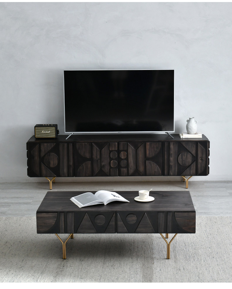 Living Well ZA modern black carved solid timber TV stand styled below a flat-screen television with a matching carved coffee table.