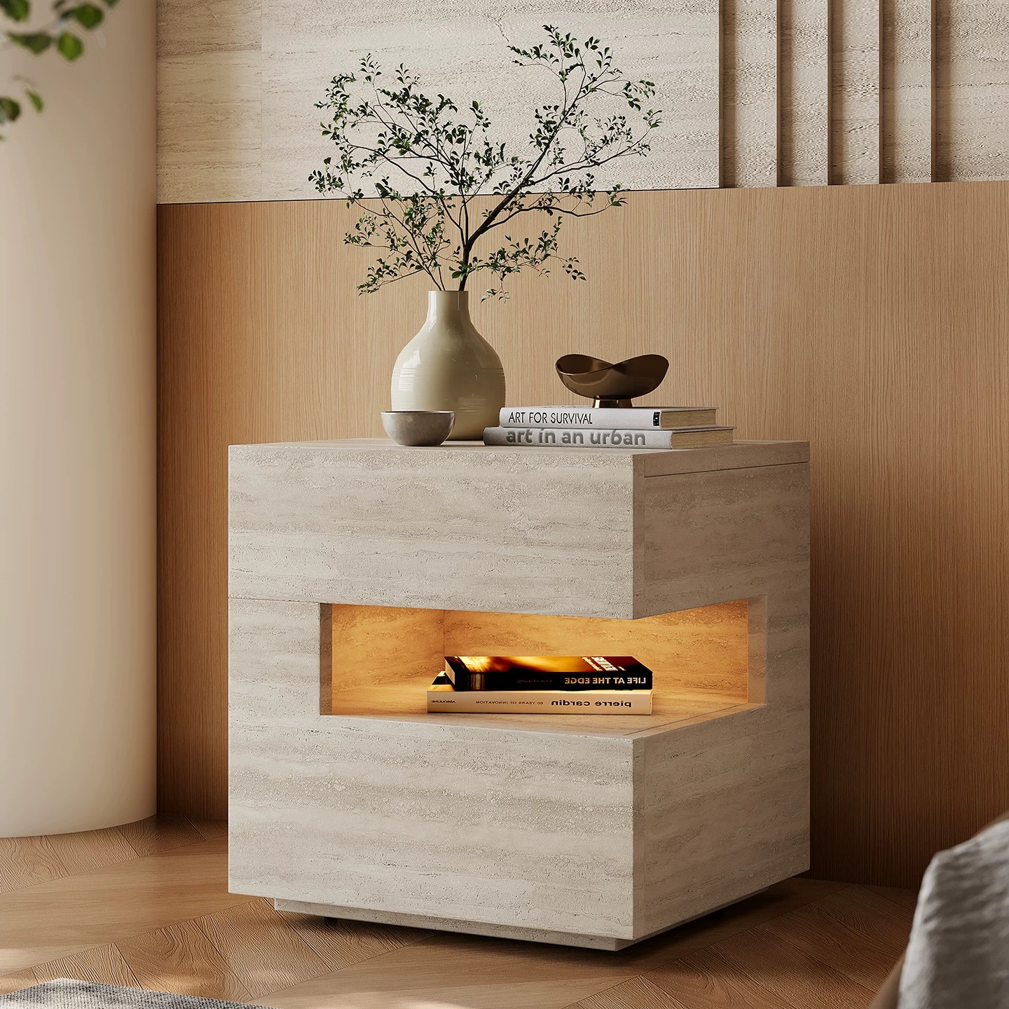 Contemporary beige travertine bedside table with built-in warm LED sensor light and books on top